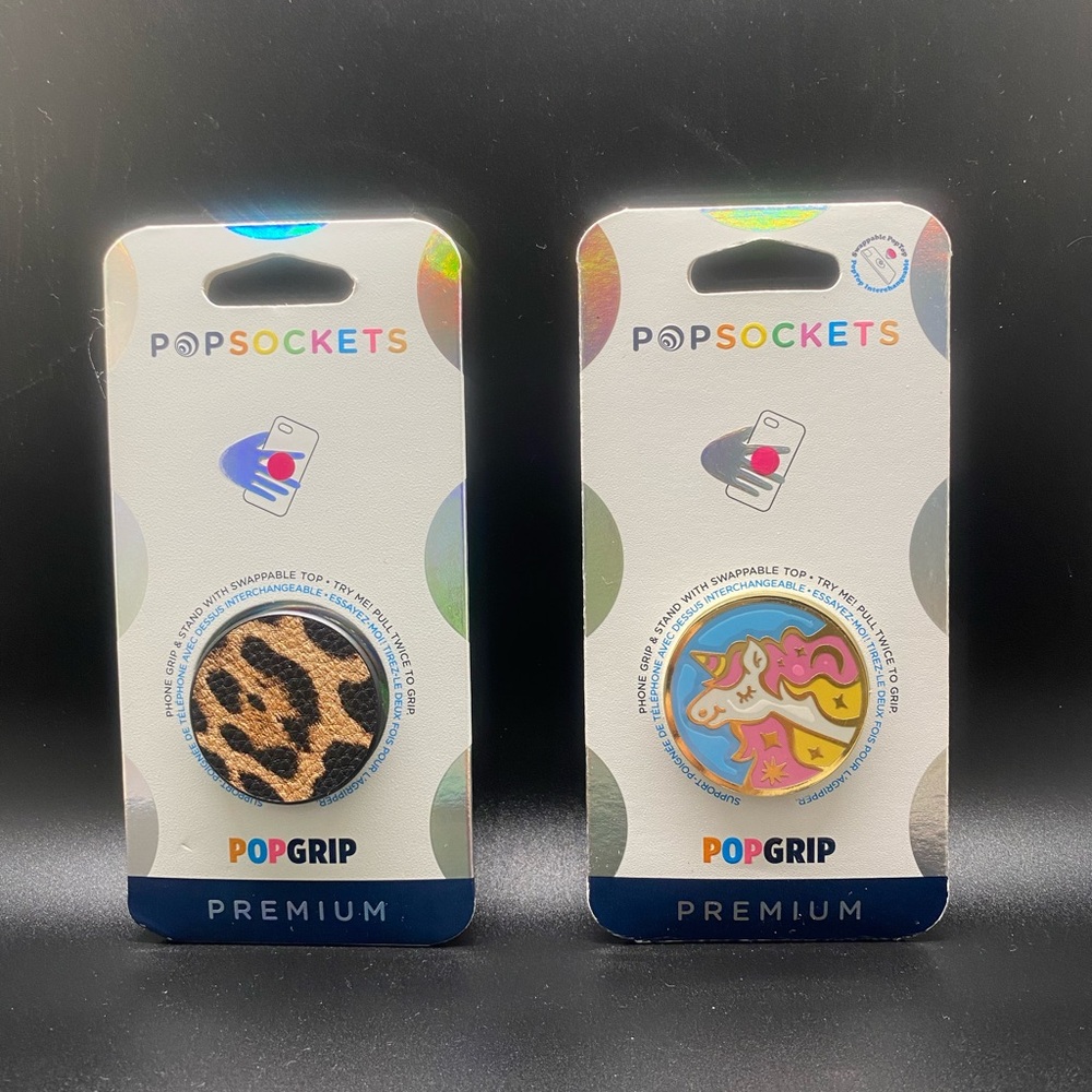 2 Brand new pop sockets. They have the interchangeable pieces.